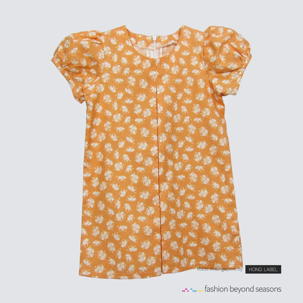 Girl orange shoe print top dress with front pleat back